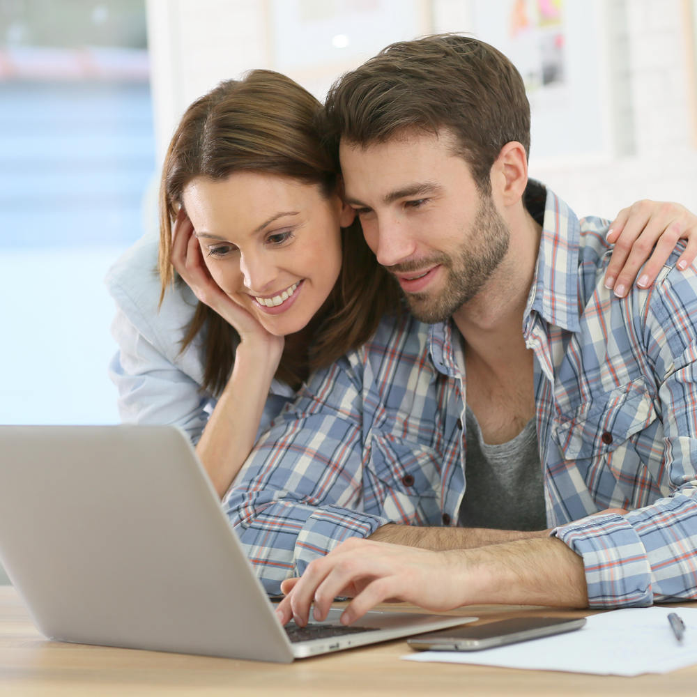 Couple,At,Home,Websurfing,On,Internet